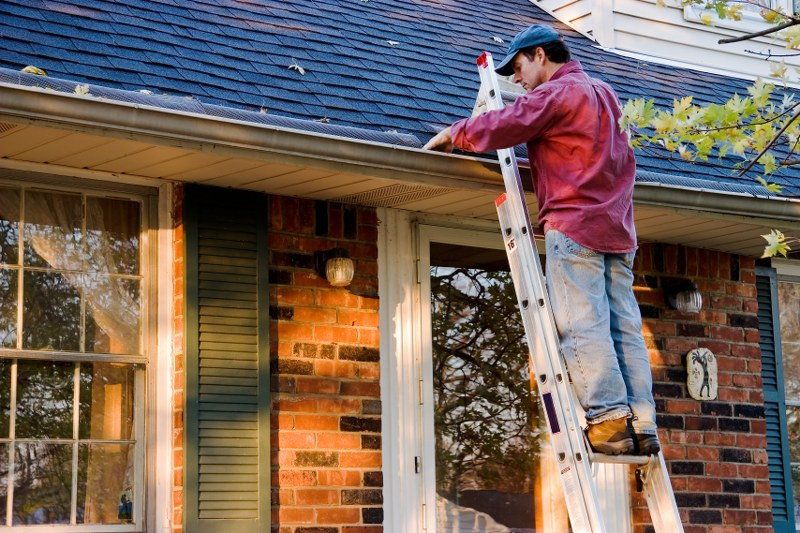 use a ladder to clean the gutters